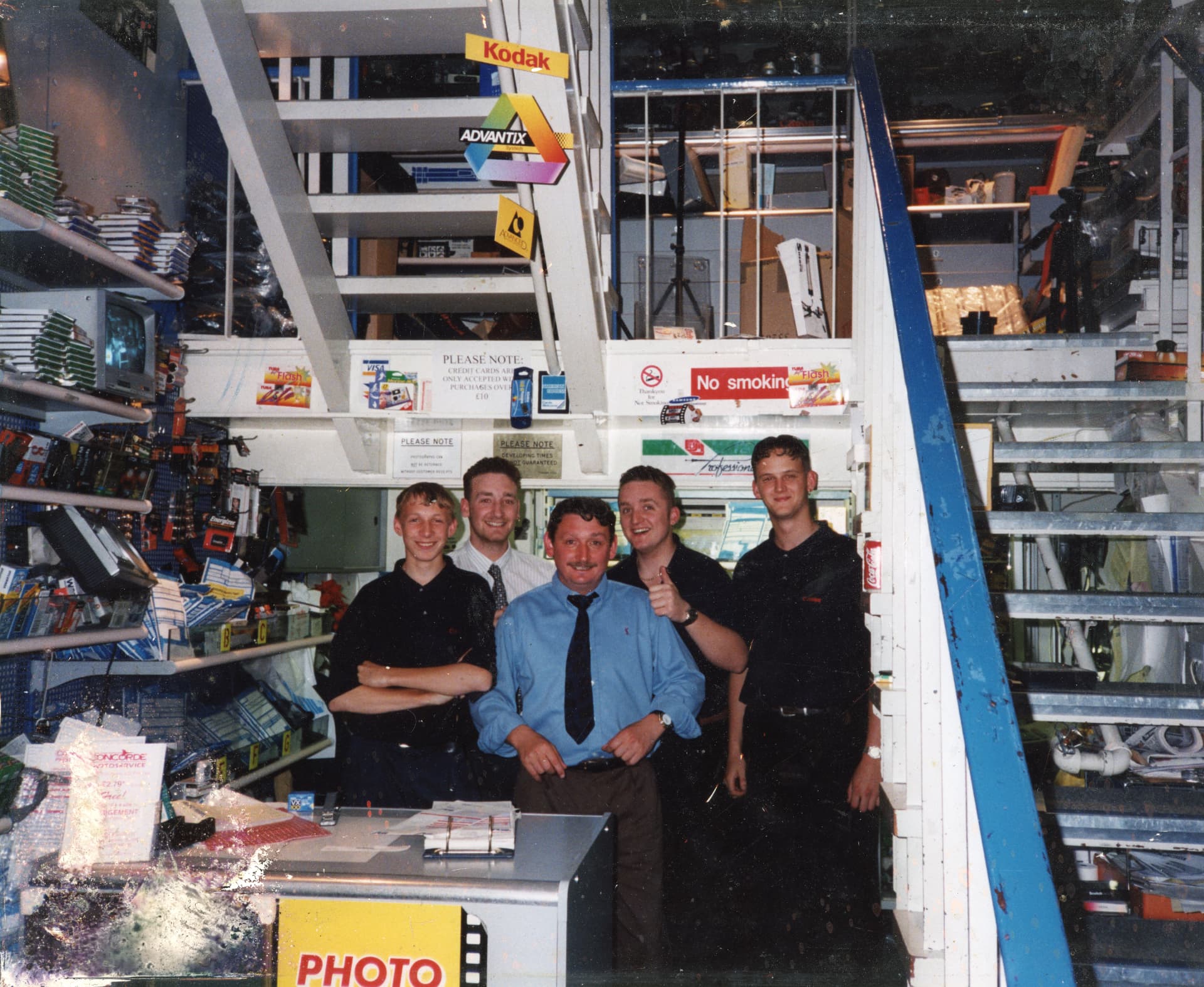 Camera Centre UK staff behind the counter in the 1990s